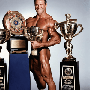 Doug Brignole proudly holding his Mr. America and Mr. Universe trophies